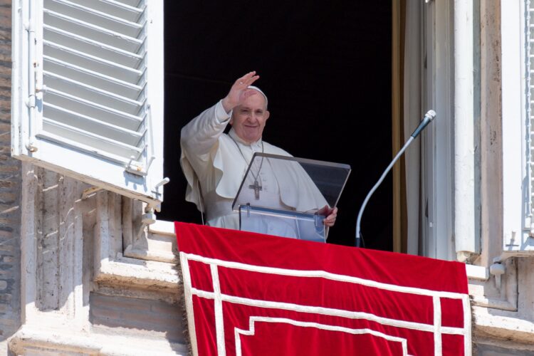 Pope Francis waves as he leads the "Regina Coeli" from the window of his studio overlooking St. Peter's Square at the Vatican April 25, 2021. The pope prayed for the victims of a fire at a Baghdad hospital and also for migrants who drowned in a shipwreck off the coast of Libya. (CNS photo/Vatican Media)