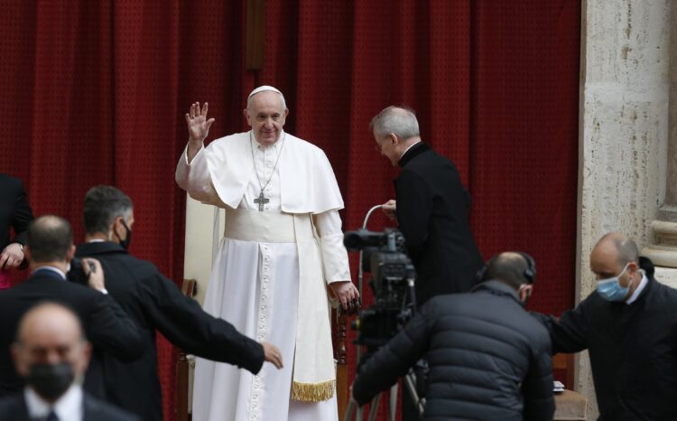 Pope Francis greets the crowd at the start of his general audience in in the San Damaso Courtyard of the Apostolic Palace at the Vatican May 19, 2021. (CNS photo/Paul Haring)