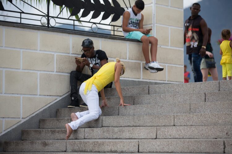 A woman in Santiago, Cuba, kneels in prayer on the steps of the National Shrine Basilica of Our Lady of Charity, also known as Our Lady of El Cobre, Nuestra Señora de la Caridad del Cobre. The basilica is one of the sites visited in Catholic Extension's video series marking May as the "Month of Mary" and highlighting the many ways Catholics of the Americas honor Mary. (CNS photo/courtesy Catholic Extension)