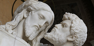 Judas kisses Jesus in this statue at the base of the Holy Stairs in Rome in this March 10 photo. The Renaissance frescoes surrounding the stairs as well as the adjacent Chapel of San Lorenzo are part of a major restoration. The project, which is expected to last another five years, involves removing layers of grime to bring back the original splendor of the artwork. (CNS photo/Paul Haring) (March 24, 2014) See VATICAN LETTER March 21, 2014.