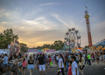 People of all ages walk around at the Our Lady of Mount Carmel Society Festival in Hammonton, NJ, on Thursday, July 15, 2021. The carnival opens nightly at 6PM.