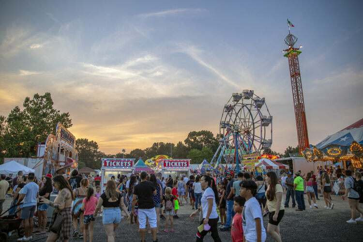 People of all ages walk around at the Our Lady of Mount Carmel Society Festival in Hammonton, NJ, on Thursday, July 15, 2021. The carnival opens nightly at 6PM.