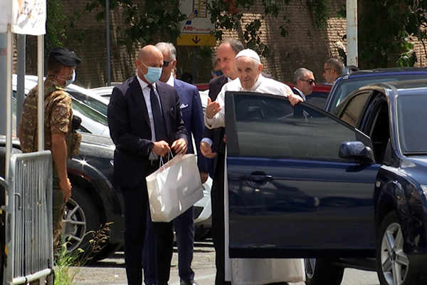 Pope Francis greets police officers before entering the Vatican after being discharged from Rome's Gemelli hospital following his recovery from colon surgery in this screengrab taken from a video July 14, 2021. (CNS photo/Cristiano Corvino, Reuters TV screengrab)