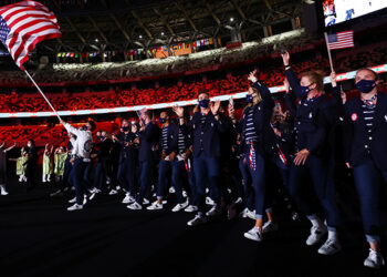 United States flag bearers Sue Bird and Eddy Alvarez lead their contingent in the parade of athletes during the opening ceremony of the Tokyo Summer Olympics July 23, 2021. (CNS photo/Stefan Wermuth, Reuters)