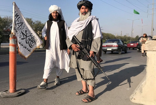 Taliban fighters stand outside the Interior Ministry in Kabul, Afghanistan, Aug. 16, 2021. During his Angelus address Aug. 15, Pope Francis expressed his concern for Afghanistan amid the Taliban's control of the country. (CNS photo/Reuters)