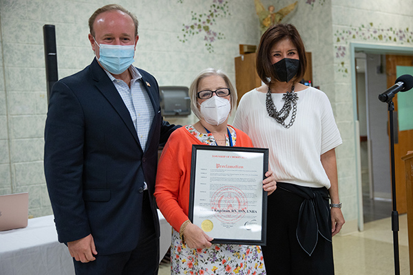 Cherry Hill Town Council President David Fleisher and Mayor Susan Shin Angulo, present a proclamation to Maureen Kogelman for her years of service at St. Mary's Center in Cherry Hill, NJ on Tuesday, September 21, 2021.