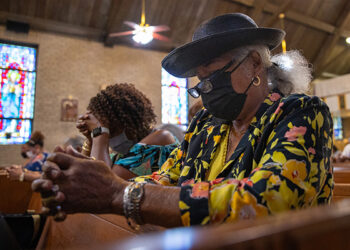 Dolly Stanton prays at Saint Bartholomew's in Camden, NJ on Sunday, September 19, 2021.