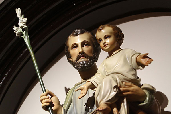 A statue of St. Joseph and the Christ Child. Pope Francis recited a prayer to St. Joseph during his weekly general audience Nov. 24. (CNS photo/Gregory A. Shemitz)