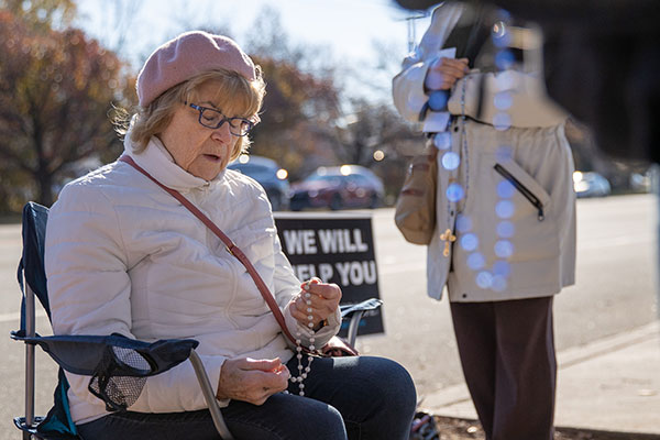 Joanne Infantado of Our Lady of Perpetual Help Parish, Maple Shade, prays the Rosary Dec. 1 outside the Cherry Hill Women's Center. Faithful from around the state prayed for 40 hours outside the clinic Nov. 30-Dec. 1 as the U.S. Supreme Court began hearing oral arguments in one of the biggest abortion cases heard in decades. Photo by Dave Hernandez