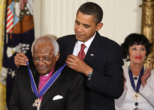 U.S. President Barack Obama presents the Medal of Freedom to Anglican Archbishop Desmond Tutu of South Africa during a ceremony at the White House in Washington Aug. 12, 2009. Archbishop Tutu died at age 90 Dec. 26. (CNS photo/Paul Haring)