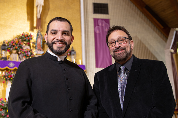 Father David Rivera and parishioner Lou Caruso pose for a photo at St. Mary of Mount Carmel Church in Hammonton, NJ on Saturday, December 11, 2021.