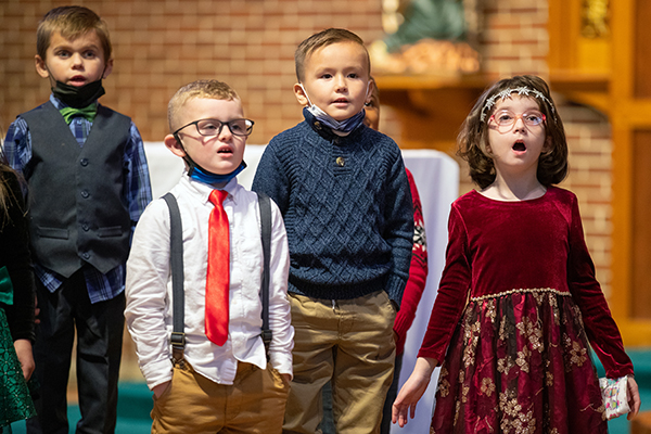 First graders sing during the annual Christmas program at Saint Teresa Regional School in Runnemede, NJ on Wednesday, December 15, 2021.
