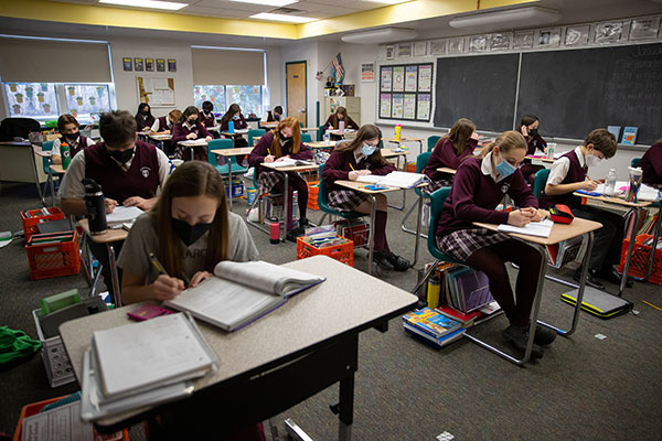 Students work in Ms. Regina Butterworth’s 7B science class Jan. 24 at Saint Margaret Regional School, Woodbury Heights. (Dave Hernandez)