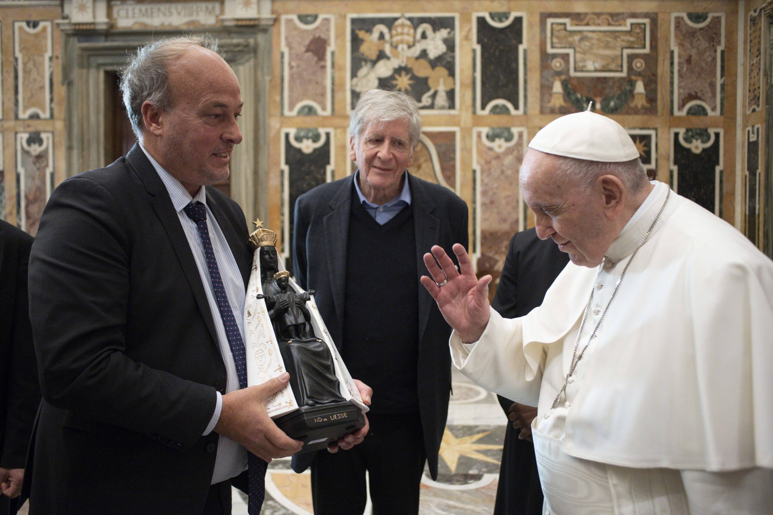 Pope Francis blesses a Marian statue during a meeting with a group of 90 business leaders from France at the Vatican Jan. 7, 2022. (CNS photo/Vatican Media)