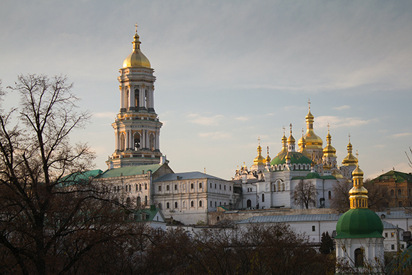 the orthodox monastery in Kiev, Ukraine in autumn and bare trees in front of it