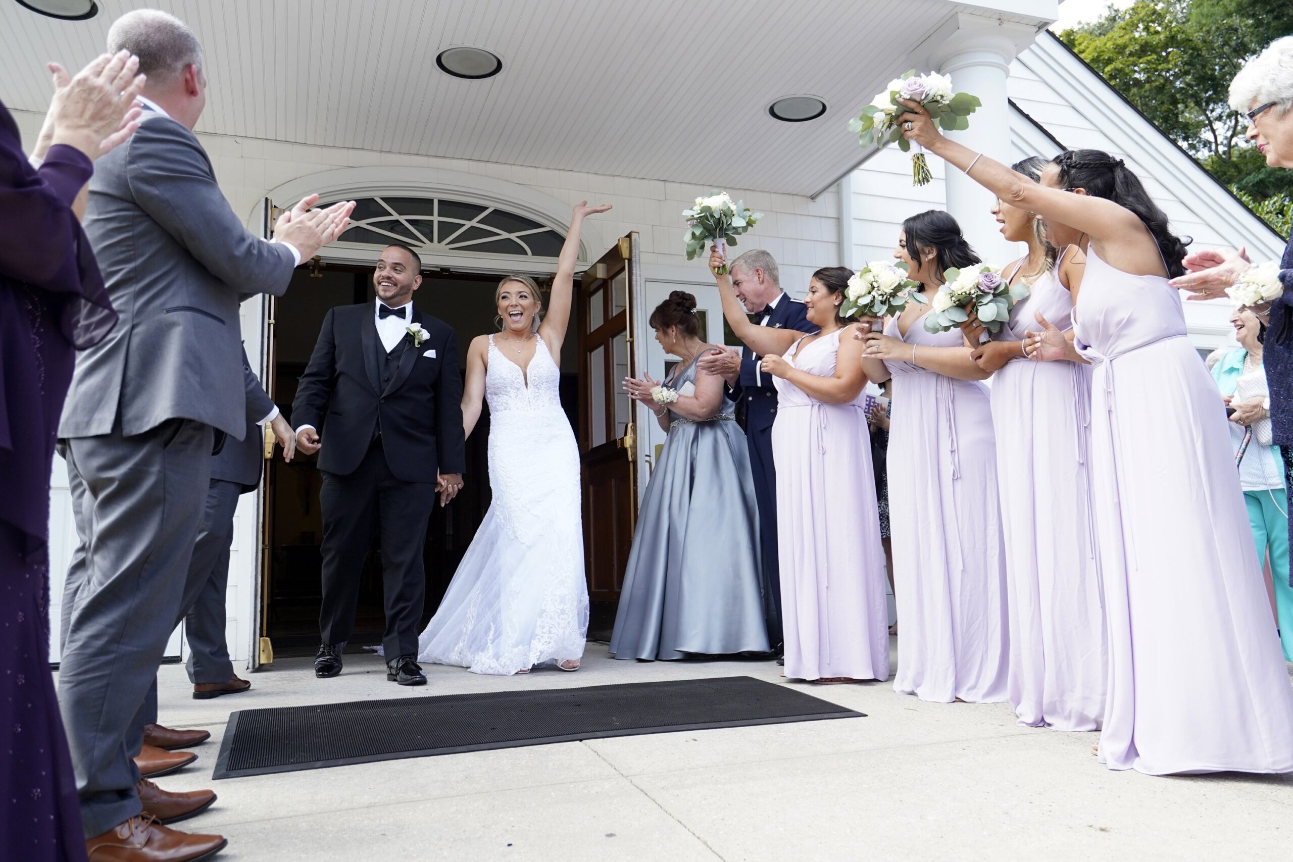 Julio Prendergast and Christina MacDougall are all smiles as they exit St. John the Baptist Church in Wading River, N.Y., following their wedding Mass Aug. 20, 2021. The theme in 2022 for National Marriage Week, celebrated annually Feb. 7-14, is "Called to the Joy of Love." World Marriage Day, observed on the second Sunday of February, is Feb. 13 this year. (CNS photo/Gregory A. Shemitz)