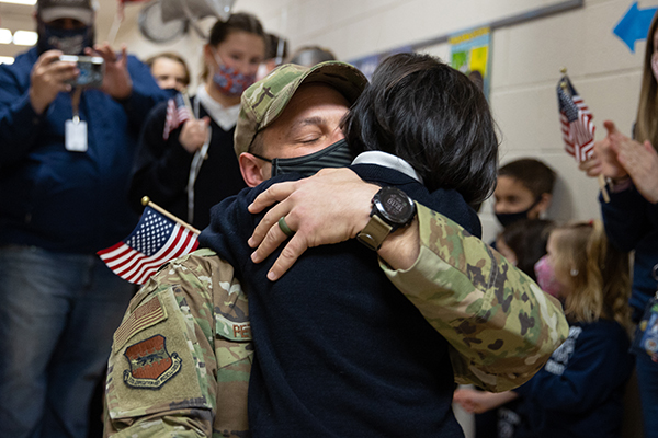 Air National Guard Technical Sergeant Victor Petrilli hugs his daughter 3rd-grader Emily, at Assumption Regional Catholic School in Galloway, NJ on Friday, January 28, 2022. Petrilli returned from a 6 month deployment and surprised his children.