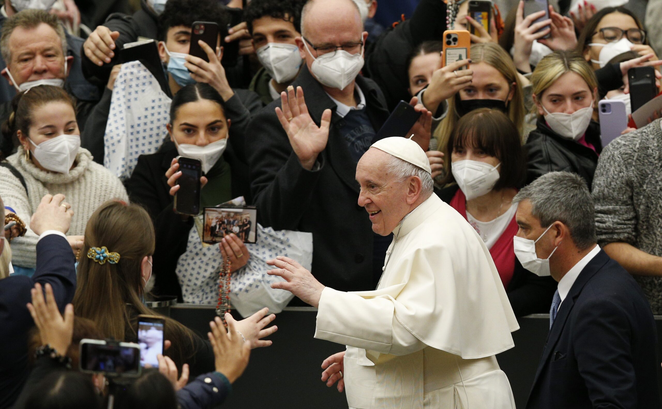 Pope Francis greets the crowd during his general audience in the Paul VI hall at the Vatican Feb. 9, 2022. (CNS photo/Paul Haring)
