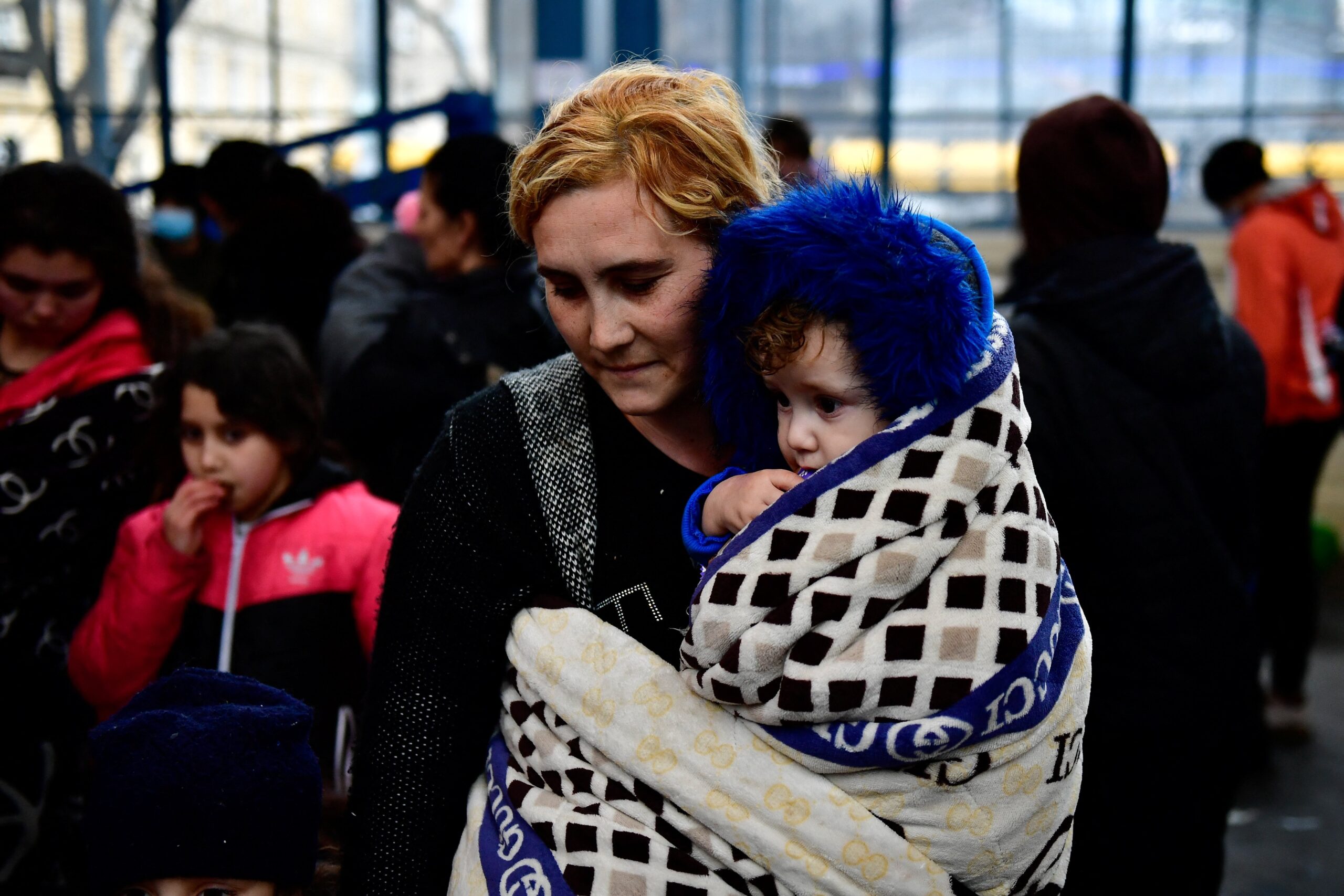 A mother fleeing from Russia's invasion of Ukraine stands with her son at Nyugati railway station, in Budapest, Hungary, Feb. 28, 2022. (CNS photo/Marton Monus, Reuters)