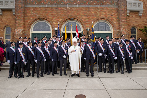 Bishop Dennis Sullivan stands with the New Jersey State Knights of Columbus outside Notre Dame de la Mer's Saint Ann Church in Wildwood on the morning of Friday, May 13.  The mass with Bishop, the Knights, and their wives kicked off the fraternal organization's 126th annual State Convention. (Dave Hernandez)