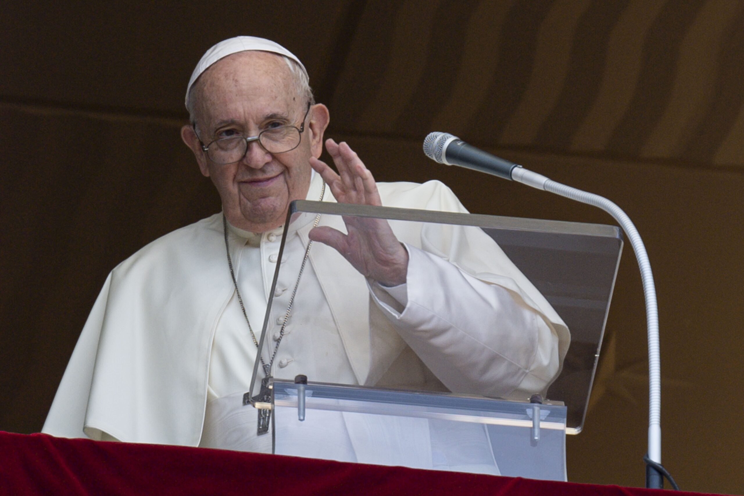 Pope Francis greets the crowd as he leads the "Regina Coeli" from the window of his studio overlooking St. Peter's Square at the Vatican May 22, 2022. The pope prayed that the church in China may live in greater communion with the universal church, in freedom and tranquility. (CNS photo/Vatican Media)