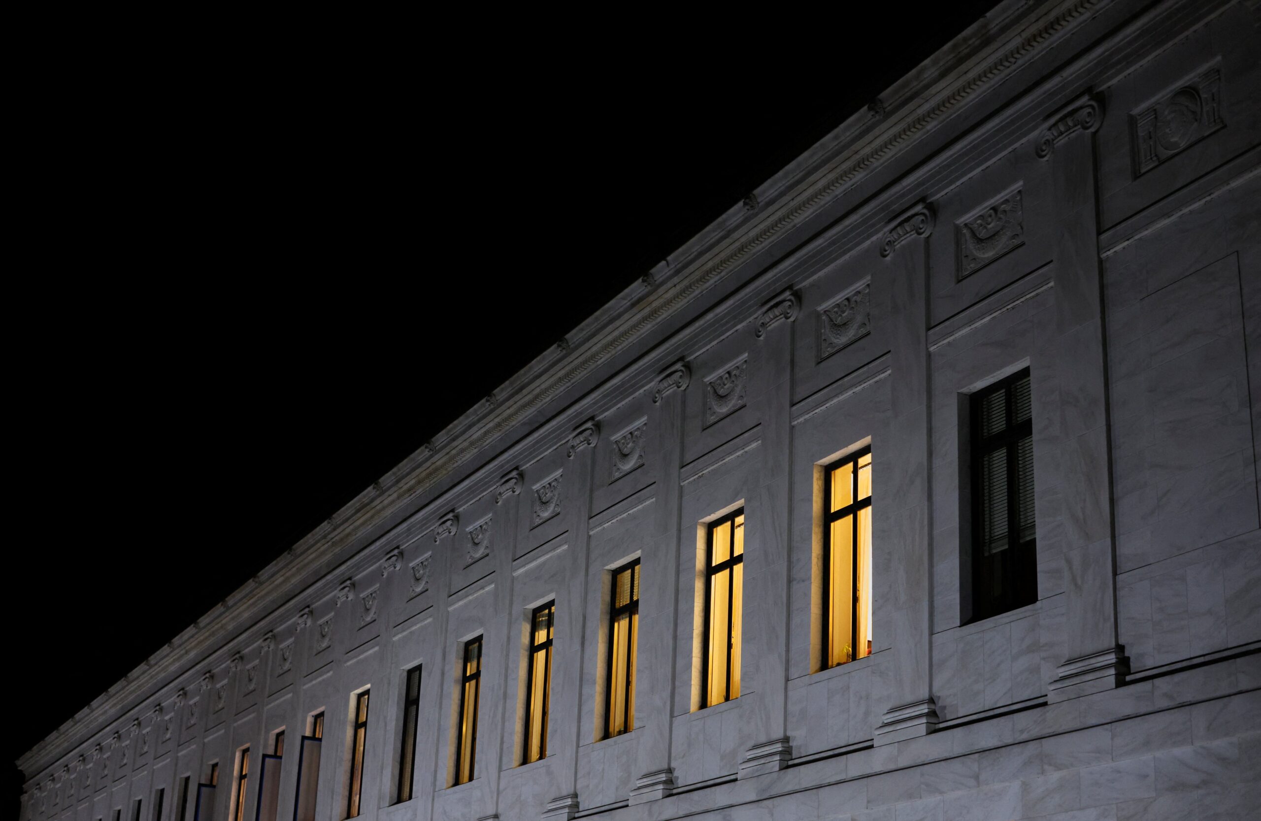 Lights burn inside U.S. Supreme Court offices in Washington May 2, 2022, after the leak of a draft majority opinion written by Justice Samuel Alito preparing for a majority of the court to overturn the landmark Roe v. Wade abortion rights decision later this year. (CNS photo/Jonathan Ernst, Reuters)
