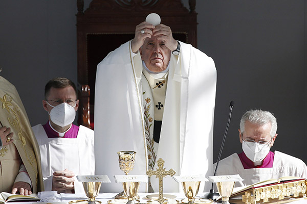 Pope Francis elevates the host as he celebrates Mass at the GSP Stadium in Nicosia, Cyprus, Dec. 3, 2021. On June 29, 2022, the pope issued issued an apostolic letter insisting Catholics need to better understand the liturgical reform of the Second Vatican Council and its goal on promoting the "full, conscious, active and fruitful celebration" of the Mass. (CNS photo/Paul Haring)