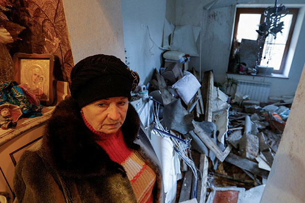 Local resident Lyudmila, 70, shows her apartment inside a house heavily damaged in recent shelling in the course of the Russian-Ukrainian conflict in Donetsk, Russian-controlled Ukraine, Dec. 6, 2022. (CNS photo/Alexander Ermochenko, Reuters)