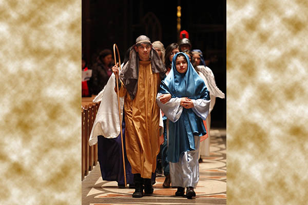 Cesar Vega and Samar Ortiz portray Joseph and Mary as they take part in the annual archdiocesan "posada" at Holy Name Cathedral in Chicago Dec. 15.  The posada commemorates the journey Mary and Joseph took from Nazareth to Bethlehem and reenacts the couple's search for shelter before the birth of Christ. After final prayers the celebration moved to the cathedral parking lot for the traditional breaking of pinatas as well as complimentary tamales and hot chocolate for all participants. (CNS/Karen Callaway, Catholic New World) (Dec. 17, 2013)