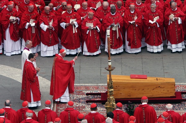 German Cardinal Joseph Ratzinger, the future Pope Benedict XVI, sprinkles holy water on the casket of Pope John Paul II during his funeral Mass in St. Peter's Square at the Vatican in this April 8, 2005, file photo. (OSV News photo/Catholic Press Photo)