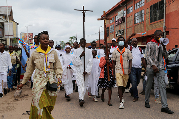 Demonstrators march during a protest by the Democratic Republic of Congo's Catholic and Protestant churches, against escalating violence in Kinshasa Dec. 4, 2022. Deadly violence hit Christians in Africa Jan. 15, 2023, with a Catholic priest in northern Nigeria burned to death and as many as 17 Christians killed in a blast in eastern DRC. (OSV News photo/Justin Makamgara, Reuters)