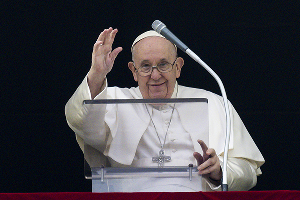 Pope Francis greets the crowd gathered in St. Peter's Square at the Vatican Jan. 15, 2023, for his midday recitation of the Angelus. (CNS photo/Vatican Media)