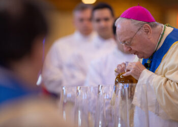 Bishop Dennis Sullivan breathes over the Sacred Chrism, symbolic of the breath of the Holy Spirit, during the Chrism Mass celebrated last year in Saint Agnes Church, Blackwood. This year’s Mass will be celebrated at 3:30 p.m. April 4 in the church. (File photo)