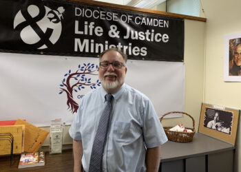 Photo by Peter G. Sánchez
Dr. Michael Sims, seen in his Camden office, is the director of Life and Justice Ministries for the Diocese. He’s been busy visiting parishes and identifying needs since starting the job in March.