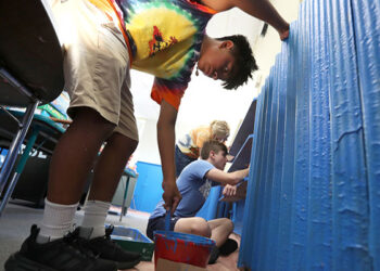 Teenagers volunteer their time painting classrooms at Our Lady Star of the Sea Regional School in Atlantic City during the annual Summer in the City immersion experience, Friday, Aug. 18, 2023. (Lori M. Nichols for Catholic Star Herald)