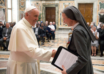 Pope Francis greets Consolata Sister Simona Brambilla, superior general of the Consolata Missionary Sisters, during a June 5 audience with the men's and women's branches of the religious missionary congregation. (CNS photo/L'Osservatore Romano)
