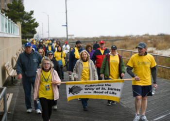 Mimi Schaible, director of Care Coordination and Consultation for VITALity Catholic Healthcare Services of the Diocese of Camden, and Deacon Joseph Janocha, VITALity’s director of hospital chaplaincy, lead pilgrims on the “Way of Saint James” walk April 20 in Ventnor.