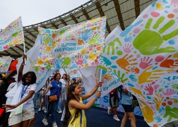 Children wave banners and flags celebrating the first World Children's Day at the Olympic Stadium in Rome, Italy, May 25, 2024. The day is mirrored after World Youth Day, but is dedicated to the world's children and the message of hope. (CNS photo/Lola Gomez)