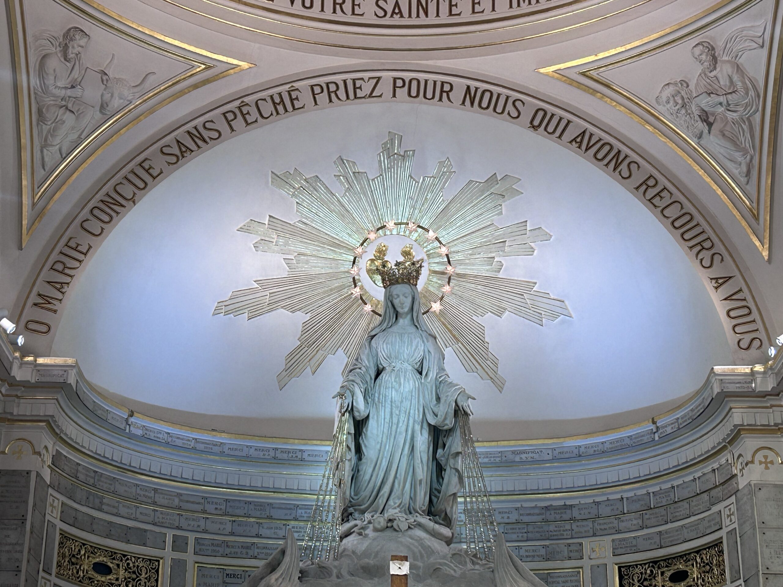 A statue of Mary seen at the Chapel of the Miraculous Medal in Paris Jan. 27, 2024, depicts one of the apparitions witnessed by Daughter of Charity Sister Catherine Laboure in 1830, during which Mary gave to the world the Miraculous Medal. (OSV News photo/Gretchen Crowe)