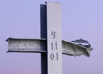 A cross made of steel from one of the fallen towers of the One World Trade Center is seen at sunrise Sept. 11, 2021, at New York's Breezy Point 9/11 Memorial on the day marking the 20th anniversary of the Sept. 11, 2001, attacks. (OSV News photo/Caitlin Ochs, Reuters)