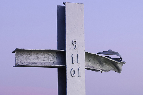 A cross made of steel from one of the fallen towers of the One World Trade Center is seen at sunrise Sept. 11, 2021, at New York's Breezy Point 9/11 Memorial on the day marking the 20th anniversary of the Sept. 11, 2001, attacks. (OSV News photo/Caitlin Ochs, Reuters)