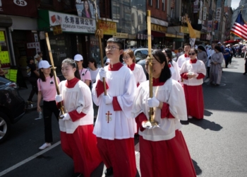 Altar servers from the Church of the Transfiguration on Mott Street in the Manhattan borough of New York City’s Chinatown, lead a Marian procession Aug. 13, 2023. New York Cardinal Timothy M. Dolan celebrated Mass ahead of the parish's annual Assumption Procession, one of New York's largest annual Marian processions. (OSV News photo/Jeffrey Bruno)