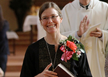 Maryknoll Sisters Julia Shideler, left, Anastasia Lee and Abby Avelino smile as they process from the chapel Sept. 28 after professing their final vows during Mass at the Maryknoll Sisters Center in Maryknoll, N.Y. (CNS photo/Gregory A. Shemitz) See MARYKNOLL Oct. 2, 2014.