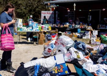Maddie Hackney, who lost everything to the hurricane, pauses while looking for clothing at a donation center organized by Janalea and Garrett England at their business Steinhatchee Fish Company, in the wake of Hurricane Helene in Steinhatchee, Fla., September 29, 2024. (OSV News photo/Kathleen Flynn, Reuters)