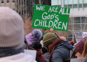 A participant holds a sign during a Jan. 25, 2025, interfaith rally in support of immigrants at Love Park in downtown Philadelphia. The event, organized by nonprofit New Sanctuary Movement, challenged city officials to push back on Trump administration policies that restrict immigration and include plans for mass deportations of unauthorized immigrants. (OSV News photo/Gina Christian)