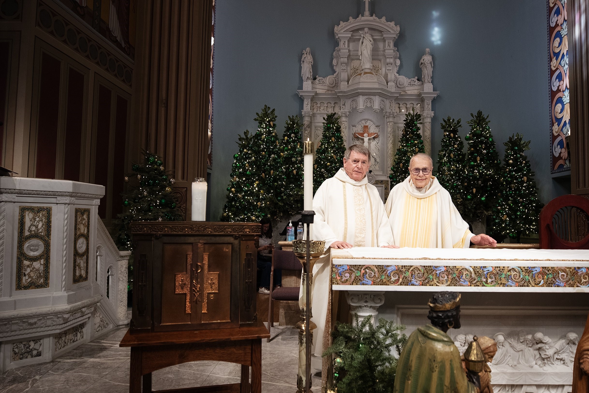 Msgr. Liam Kidney, left, and Msgr. Lloyd Torgerson are pictured at St. Monica Church with the recovered tabernacle from Corpus Christi Church. (OSV News photo/Victor Alemán, Angelus)