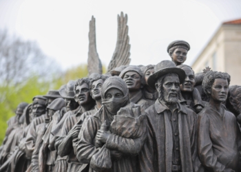 The sculpture "Angels Unawares" is seen at The Catholic University of America in Washington April 22, 2022. The life-size sculpture, which depicts a group of migrants and refugees crowded on a boat, is a replica of the original one Pope Francis unveiled in St. Peter's Square at the Vatican during the 2019 World Day of Migrants and Refugees. (OSV News/CNS file, Andrew Biraj, Catholic Standard)