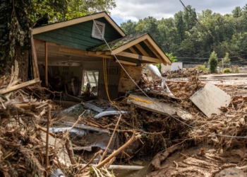 A destroyed house with a car under it in Chimney Rock, N.C., is seen Sept. 29, 2024, after the remnants of Hurricane Helene hit the town. The storm made landfall the night of Sept. 27 in Florida's Big Bend region as a Category 4 hurricane and was downgraded to a tropical storm the next morning. (OSV News photo/Khadejeh Nikouyeh, The Charlotte Observer handout via Reuters) Editors: THIS IMAGE HAS BEEN SUPPLIED BY A THIRD PARTY. MANDATORY CREDIT. NO RESALES. NO ARCHIVES