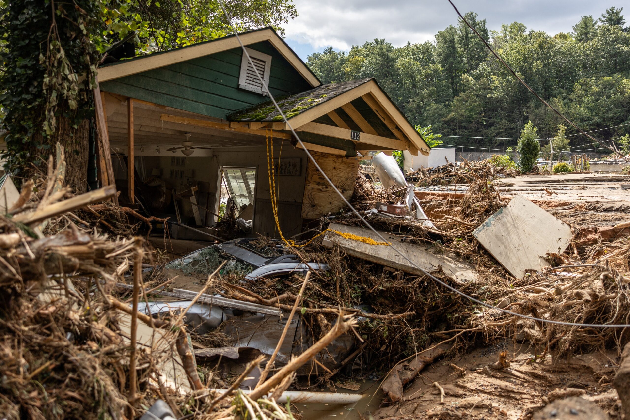 A destroyed house with a car under it in Chimney Rock, N.C., is seen Sept. 29, 2024, after the remnants of Hurricane Helene hit the town. The storm made landfall the night of Sept. 27 in Florida's Big Bend region as a Category 4 hurricane and was downgraded to a tropical storm the next morning. (OSV News photo/Khadejeh Nikouyeh, The Charlotte Observer handout via Reuters) Editors: THIS IMAGE HAS BEEN SUPPLIED BY A THIRD PARTY. MANDATORY CREDIT. NO RESALES. NO ARCHIVES