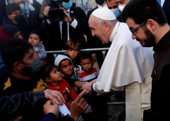 Pope Francis reacts as he meets migrants during his visit to the Mavrovouni camp for refugees and migrants on the island of Lesbos, Greece, Dec. 5, 2021. Pope Francis, formerly Argentine Cardinal Jorge Mario Bergoglio, died April 21, 2025, at age 88. (CNS photo/Guglielmo Mangiapane, Reuters)